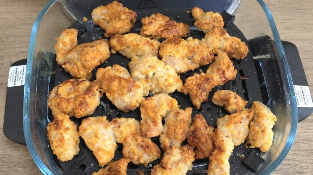 Golden, crispy coated chicken pieces in the air fryer
