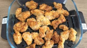 Golden, crispy coated chicken pieces in the air fryer