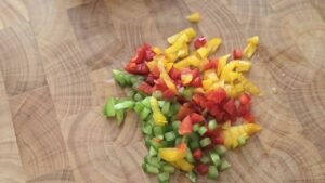 Diced red, yellow and green bell peppers