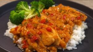 Glazed gochujang chicken over steamed rice with blanched broccoli
