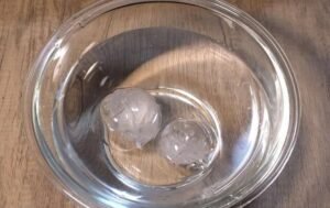 Bowl of ice water for shocking the poached chicken