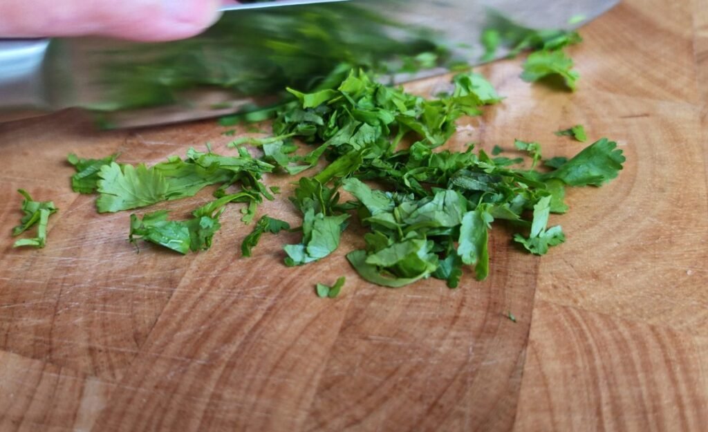 Freshly chopped parsley on a chopping board